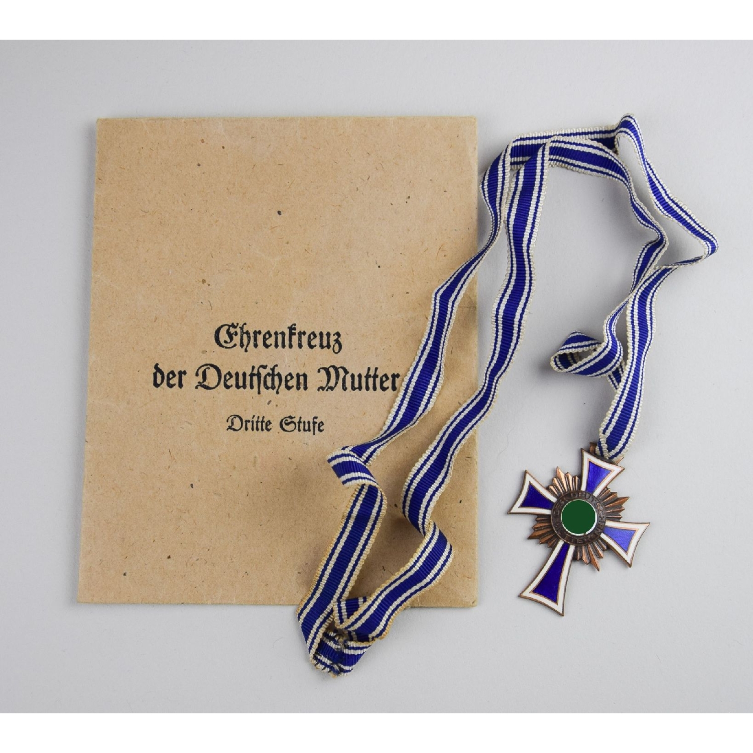 Ehrenkreuz der Deutschen Mutter Mutterkreuz in Bronze in Tüte, Herst. Sohni, Heubach & Co, Metallwarenfabrik Oberstein/Nahe